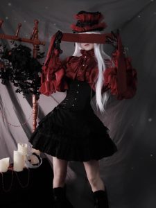 the lolita shirt from the dragon bone cemetery is worn inside with a gothic prince outfit