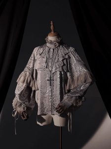 the lolita shirt from the dragon bone cemetery is worn inside with a gothic prince outfit