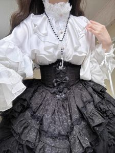 the lolita shirt from the dragon bone cemetery is worn inside with a gothic prince outfit