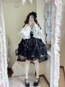 the lolita shirt from the dragon bone cemetery is worn inside with a gothic prince outfit