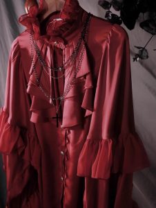 the lolita shirt from the dragon bone cemetery is worn inside with a gothic prince outfit